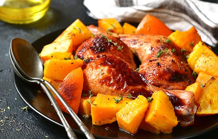 chicken on butternut squash on a plate