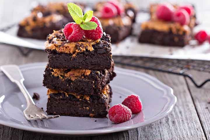 brownies and raspberries on a plate
