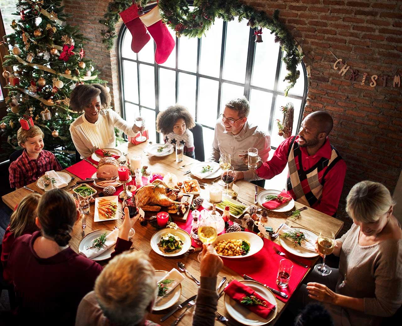 family celebrating at Christmas table